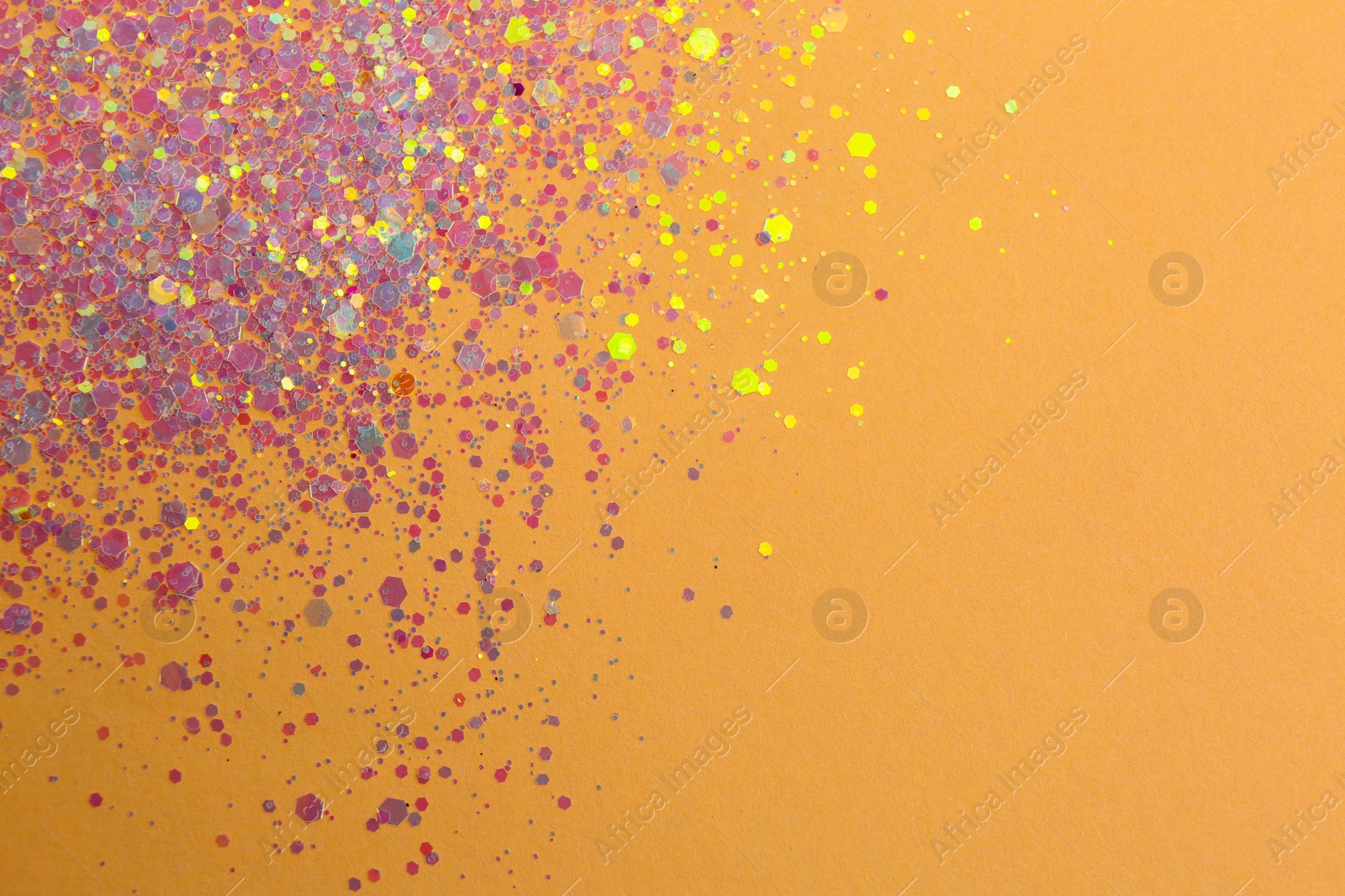 Photo of Shiny bright lilac glitter on beige background, flat lay. Space for text