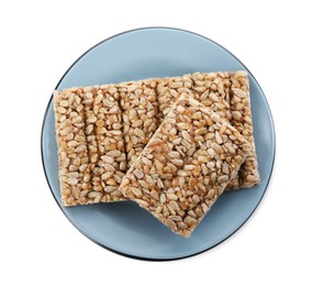 Photo of Delicious sweet kozinaki bars on white background, top view