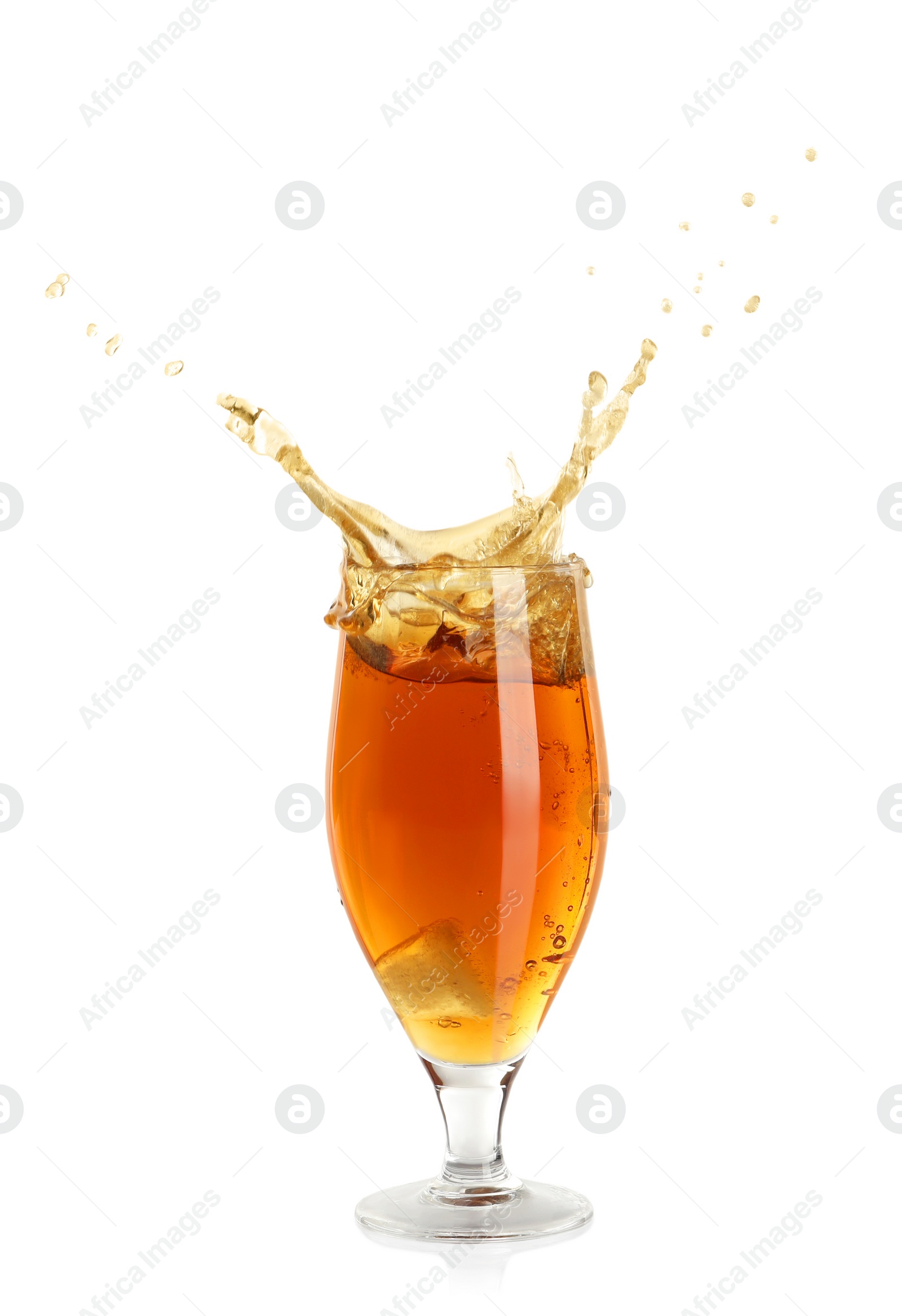 Photo of Beer splashing out of glass on white background