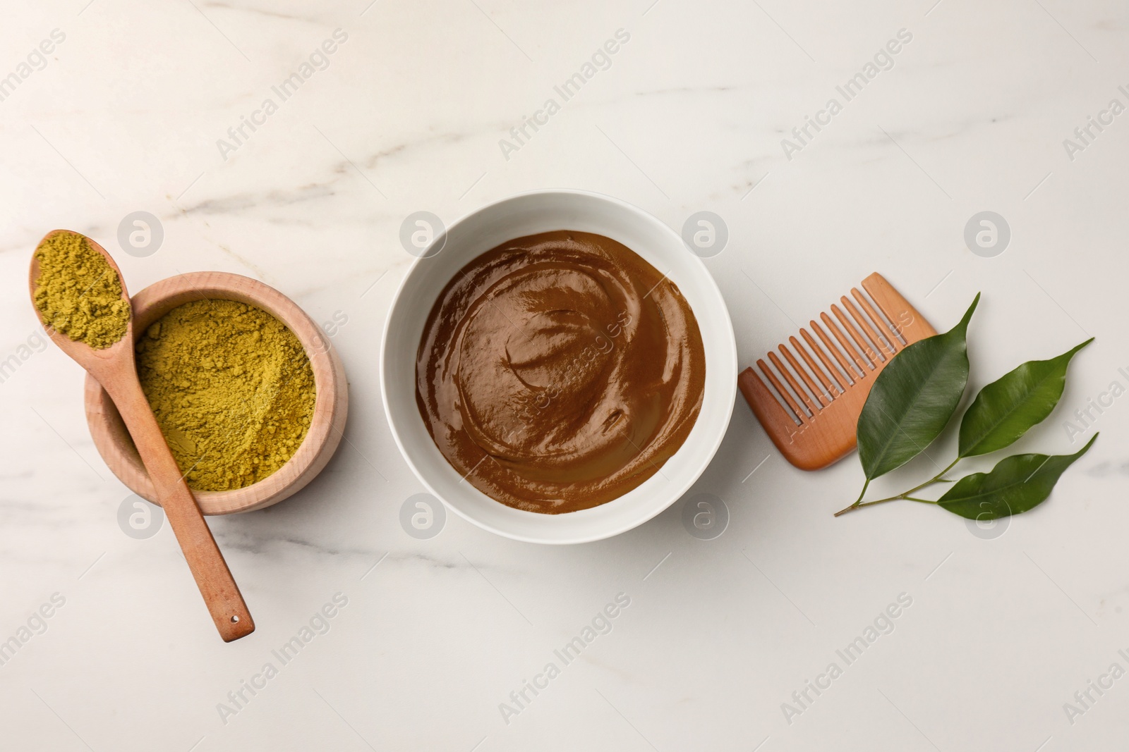 Photo of Flat lay composition with henna powder and cream on white marble table. Natural hair coloring