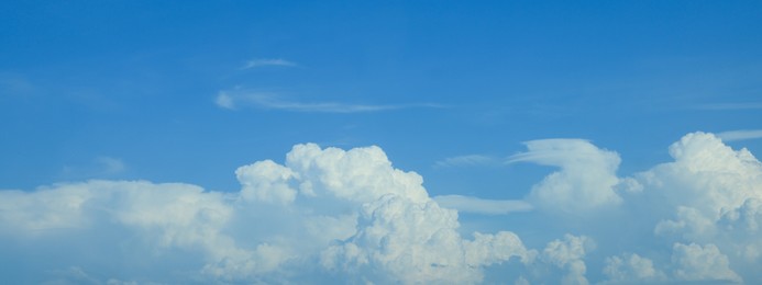 Image of Beautiful blue sky with white fluffy clouds. Banner design