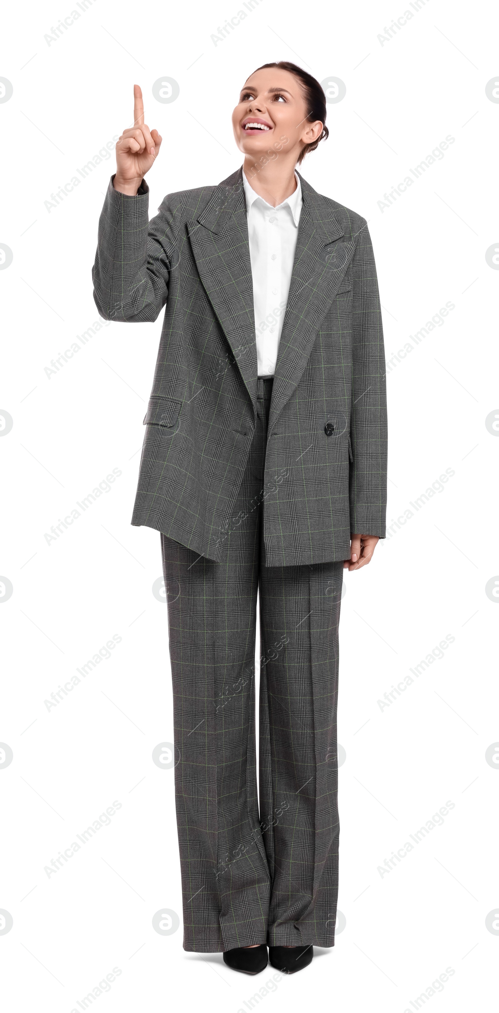 Photo of Beautiful businesswoman in suit pointing at something on white background