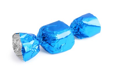 Tasty candy in blue wrapper isolated on white