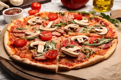 Photo of Hot delicious pizza baked in oven on table