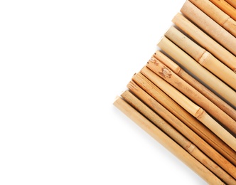 Photo of Row of bamboo sticks on white background