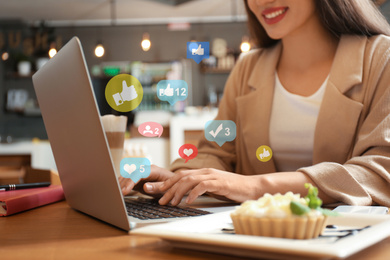 Image of Blogger working with laptop in cafe, closeup