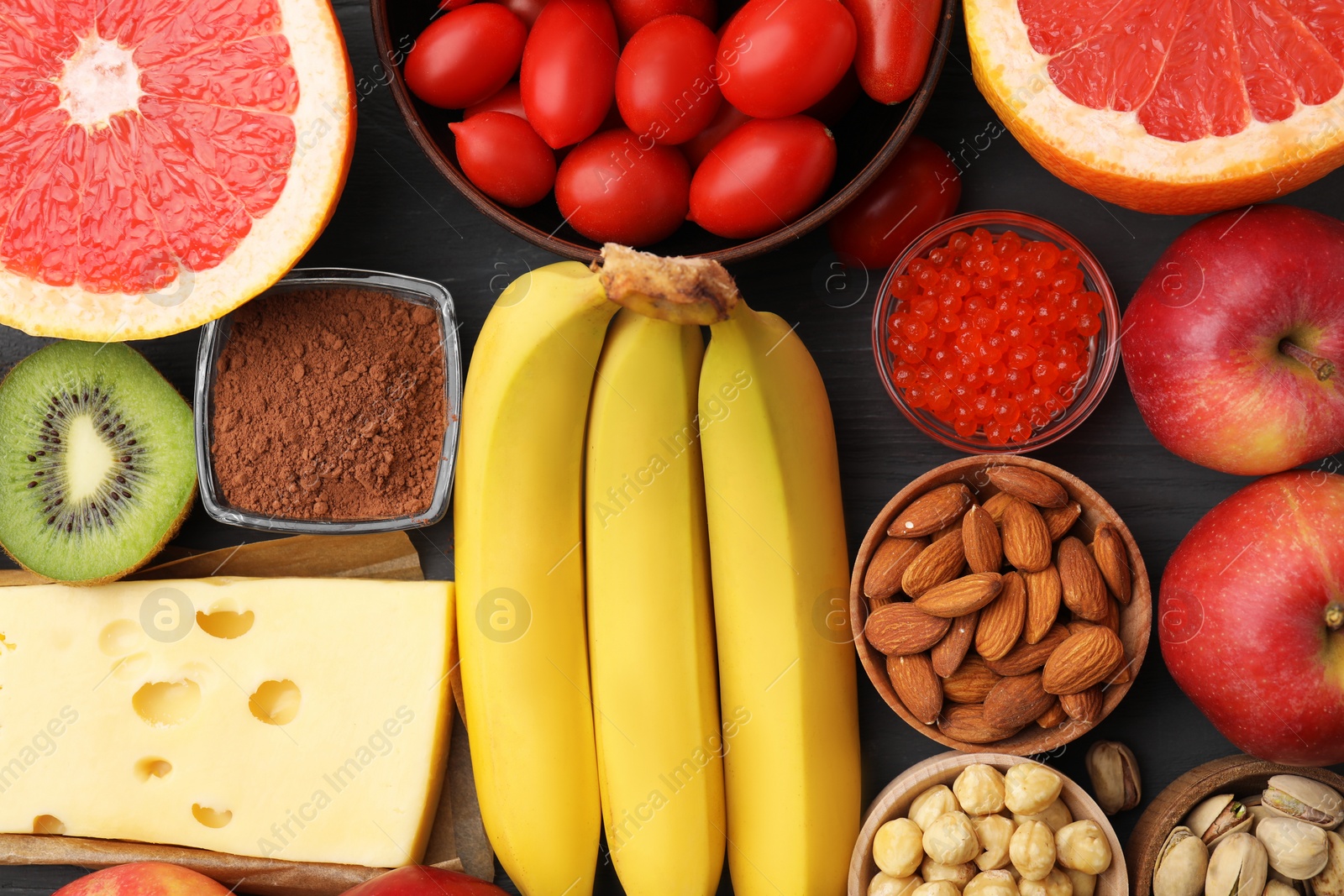 Photo of Many different products on table, flat lay. Natural sources of serotonin