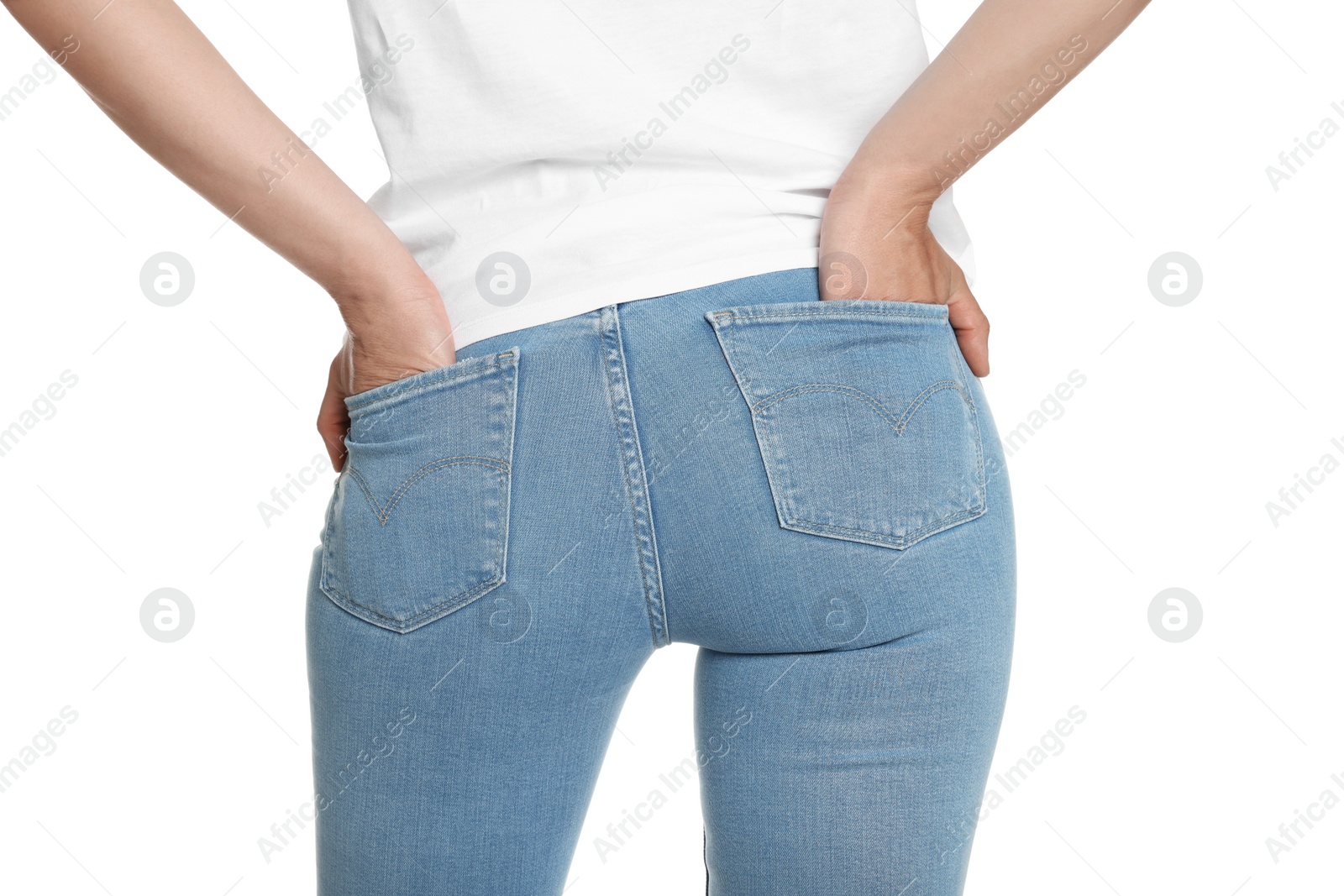 Photo of Woman wearing stylish light blue jeans on white background, closeup