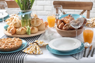 Festive Easter table setting with traditional meal at home