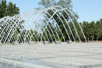 City square with beautiful fountains on sunny day