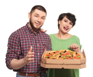 Attractive young couple with delicious pizza on white background