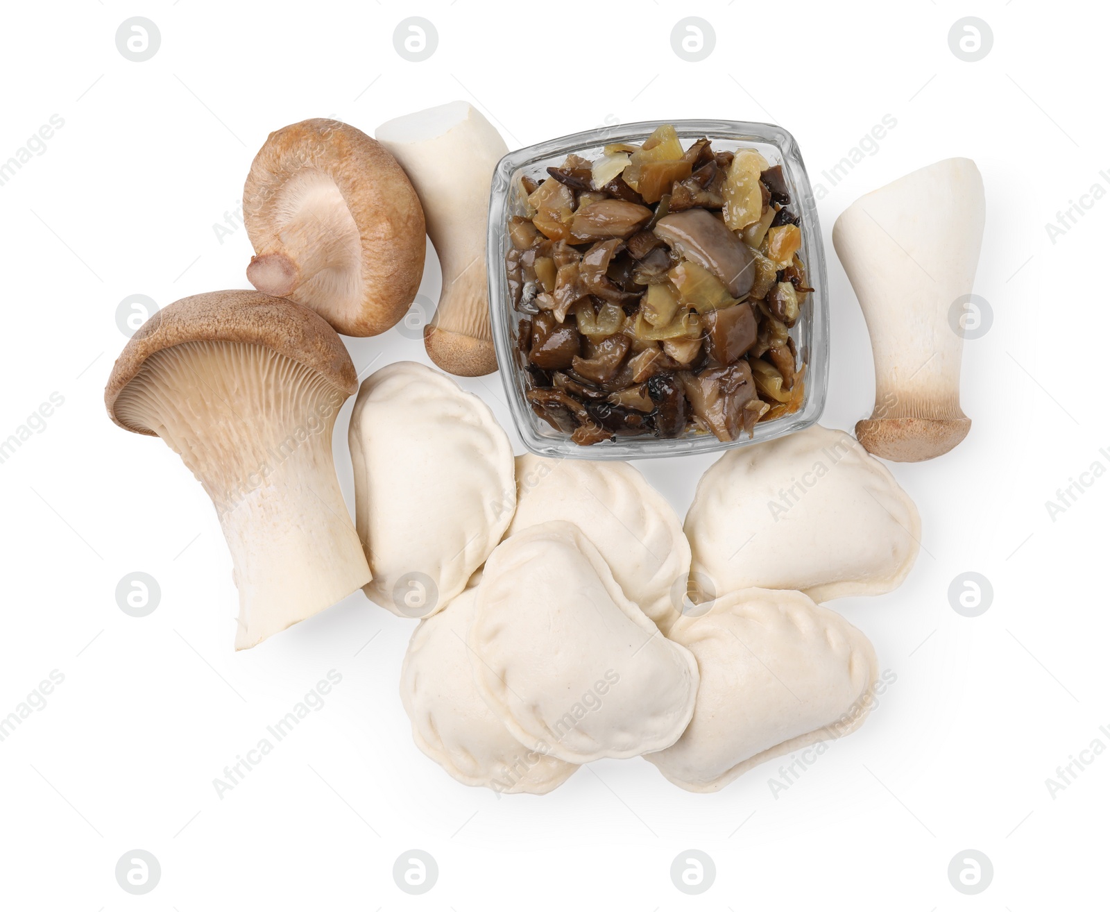 Photo of Raw dumplings (varenyky) and cooked mushrooms isolated on white, top view