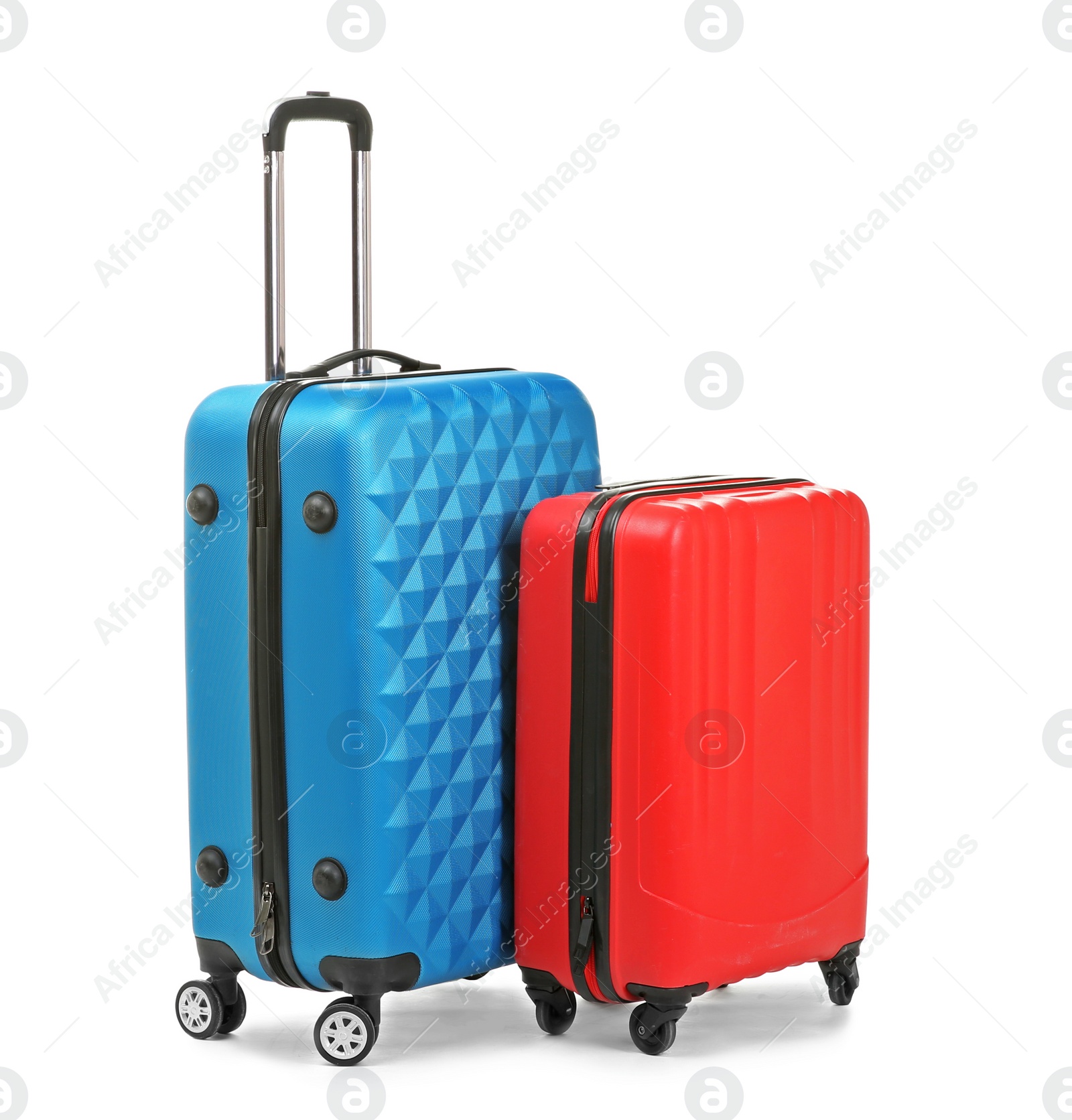 Photo of Packed stylish suitcases on white background. Traveler's luggage