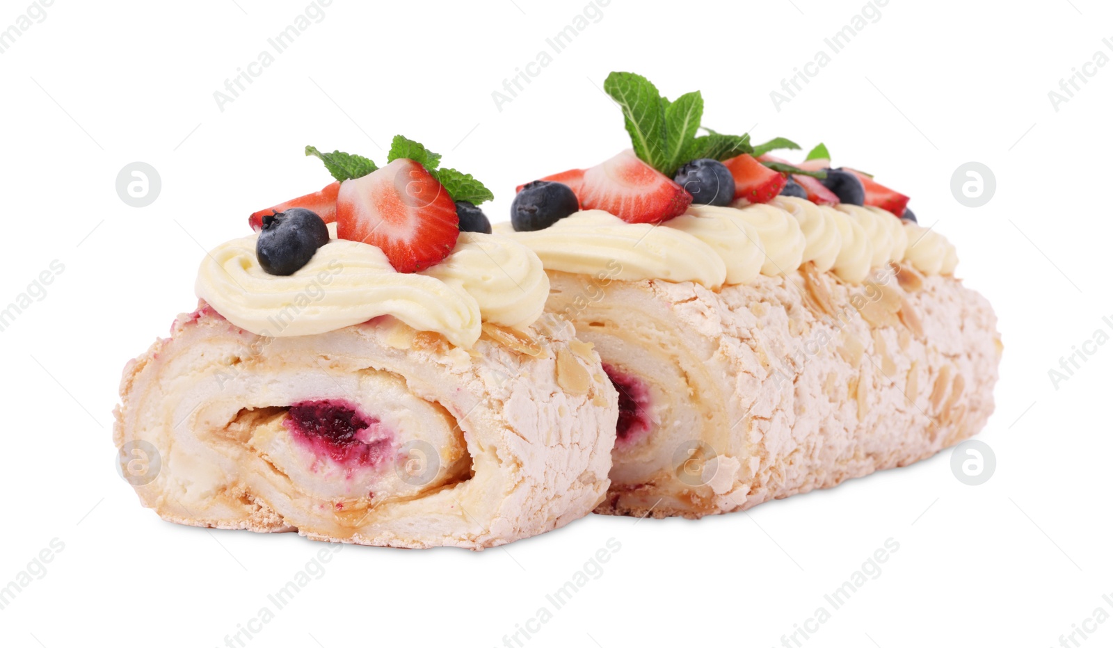 Photo of Tasty meringue roll with jam, berries and mint leaves isolated on white