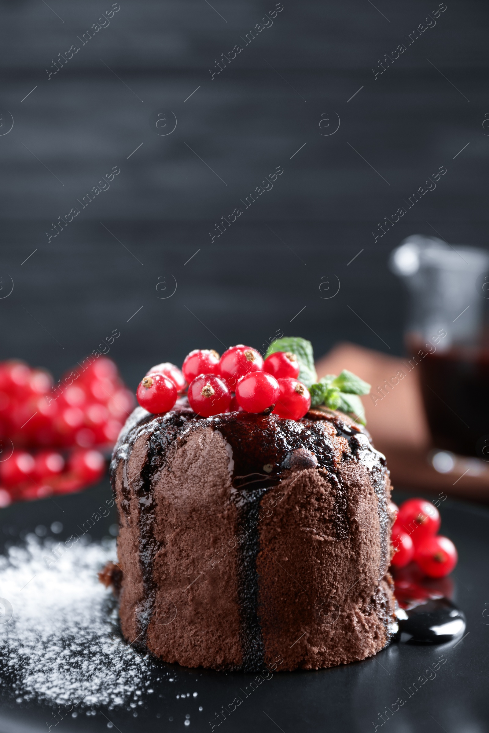 Photo of Delicious warm chocolate lava cake with mint and berries on plate, closeup. Space for text