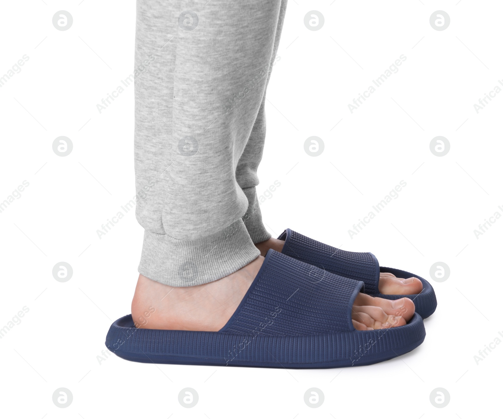 Photo of Man in blue slippers on white background, closeup