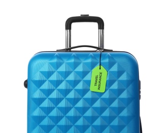 Photo of Blue suitcase with TRAVEL INSURANCE label on white background