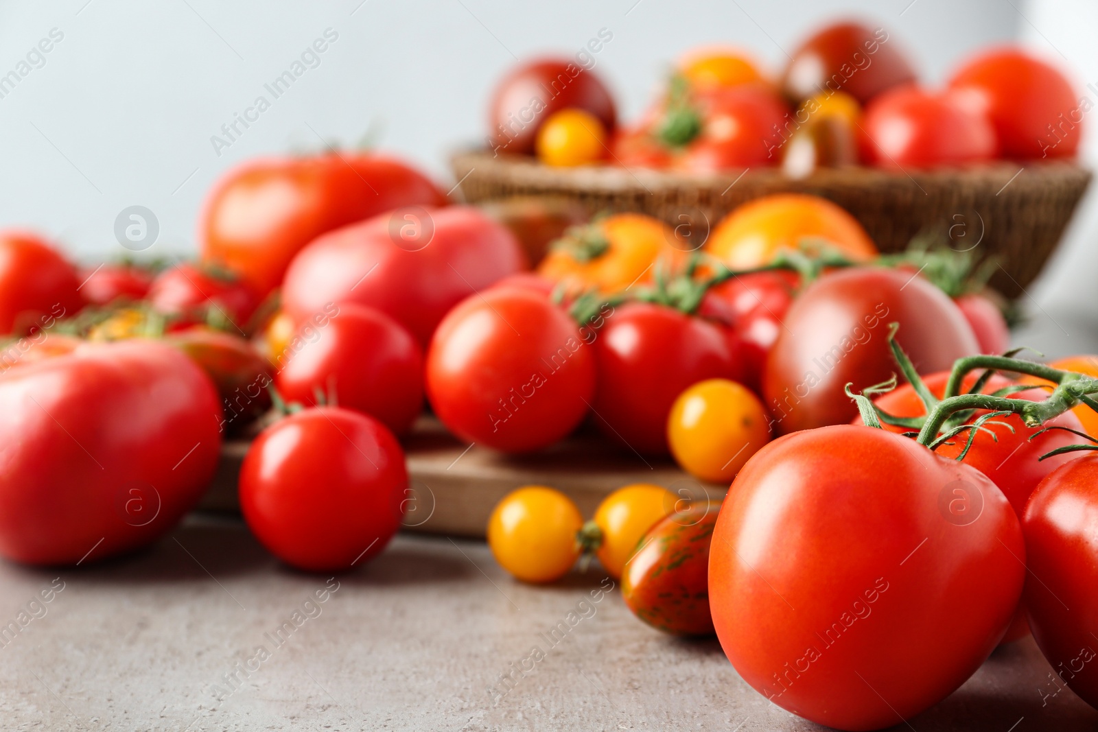 Photo of Many fresh ripe tomatoes on table, closeup