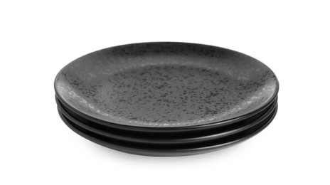 Photo of Three black ceramic plates isolated on white