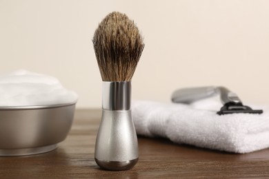 Set of men's shaving tools on wooden table