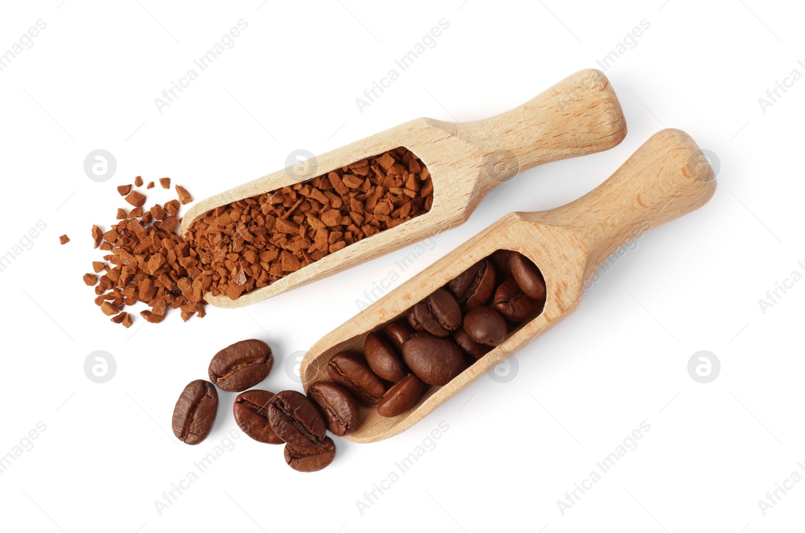 Photo of Scoops with instant coffee and roasted beans on white background, top view