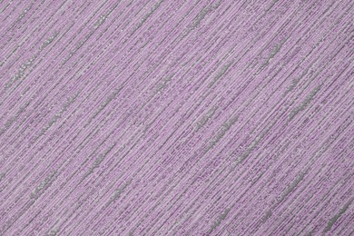 Purple wallpaper sheet as background, top view