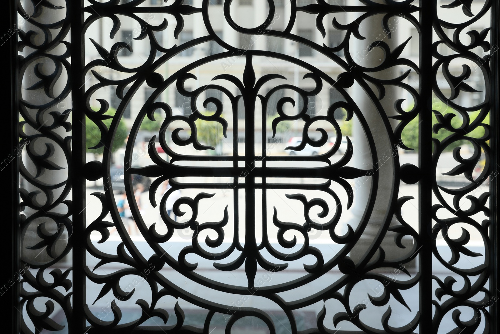 Photo of Athens, Greece - May 25, 2022: Beautiful black window grill of Holy Trinity Church