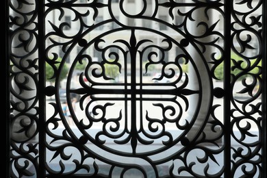 Photo of Athens, Greece - May 25, 2022: Beautiful black window grill of Holy Trinity Church