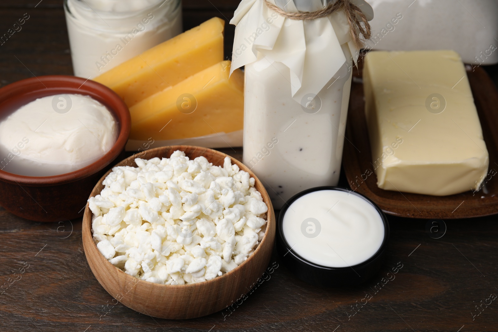 Photo of Different fresh dairy products on wooden table