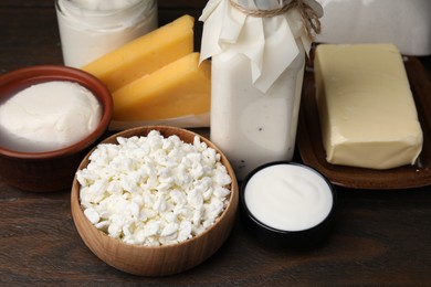 Photo of Different fresh dairy products on wooden table