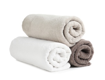 Photo of Rolled soft terry towels on white background