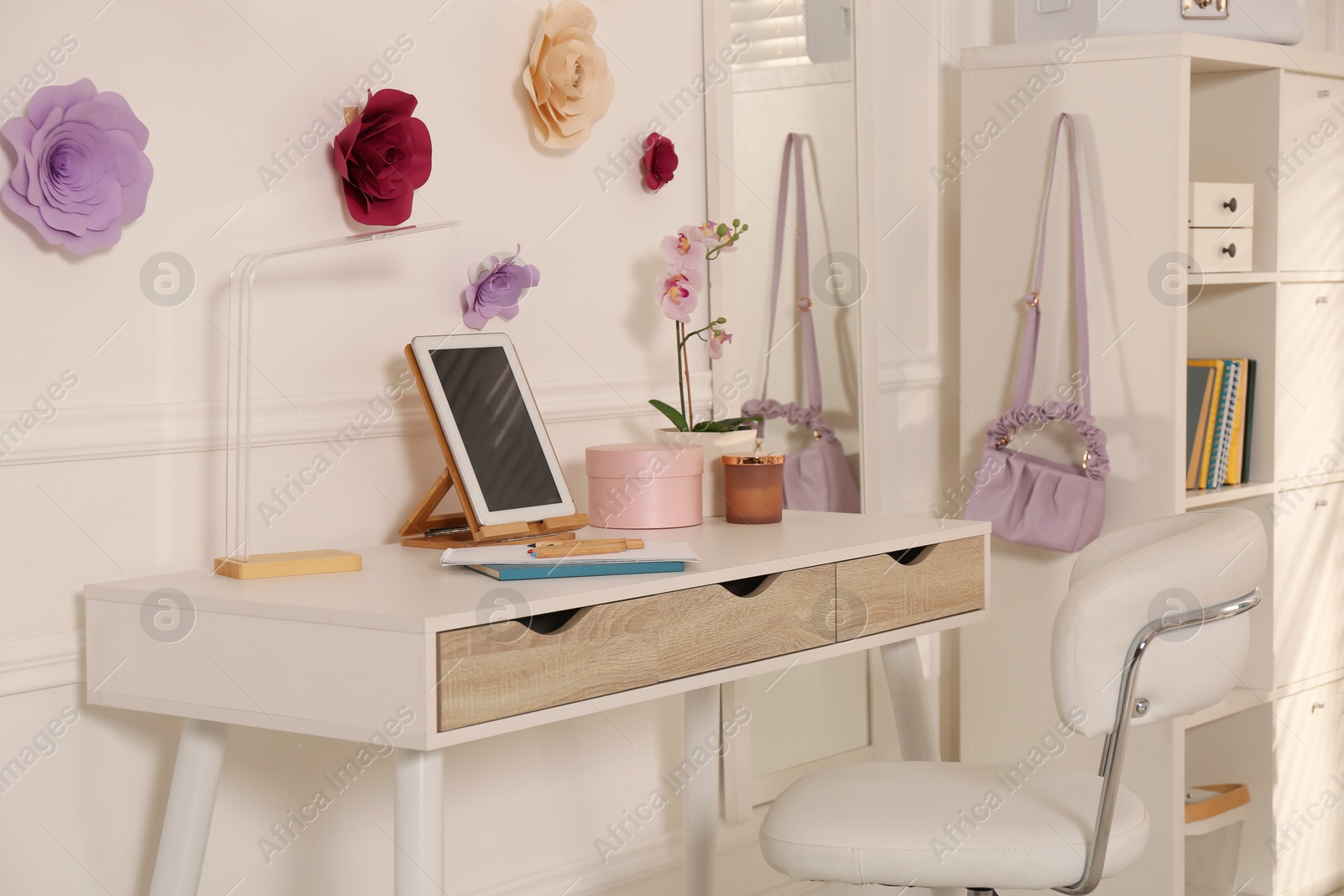 Photo of Stylish teenager's room interior with computer and floral decor