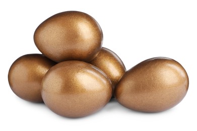 Many shiny golden eggs on white background