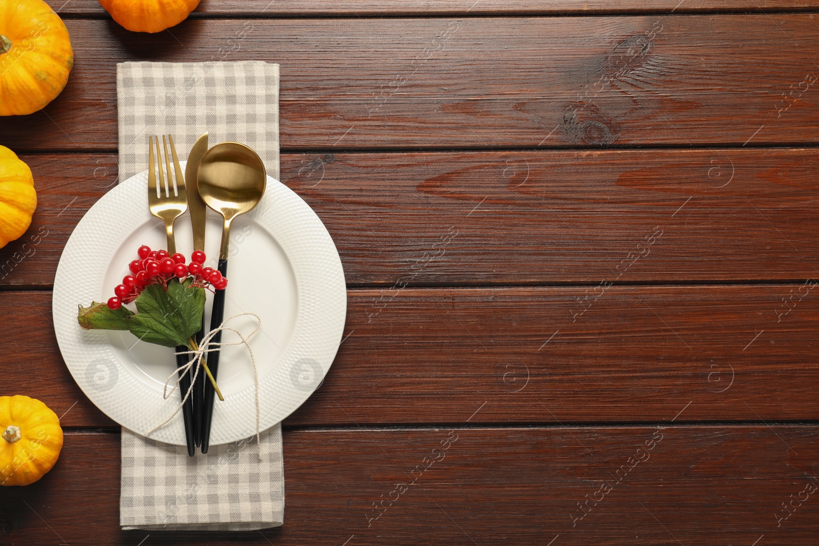 Beautiful autumn table setting on wooden background, flat lay. Space for text Photo of Beautiful autumn table setting on wooden background, flat lay. Space for text