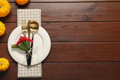 Photo of Beautiful autumn table setting on wooden background, flat lay. Space for text