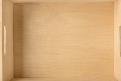 Photo of Top view of rustic wooden crate, closeup