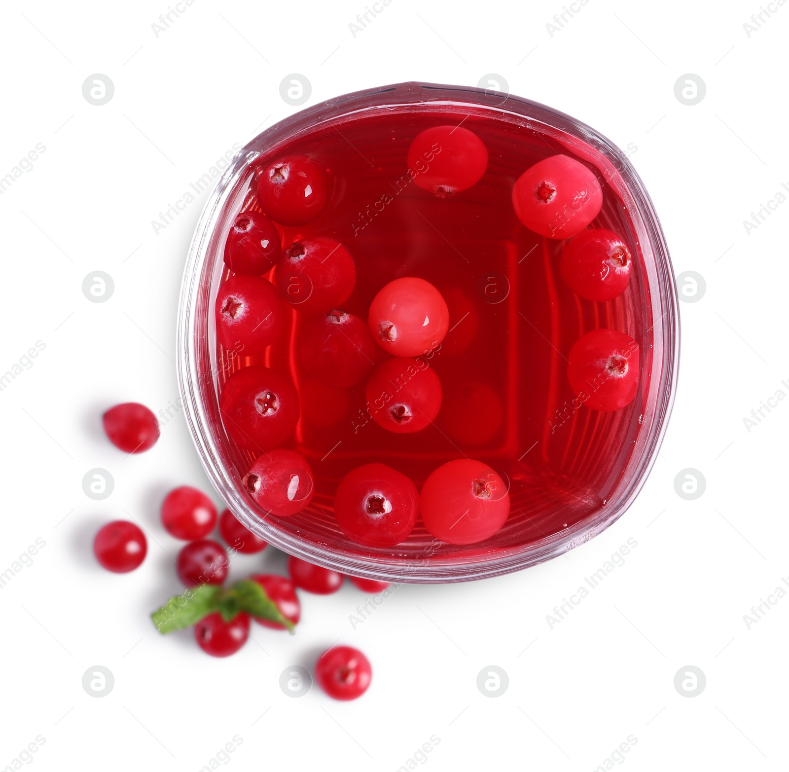 Photo of Tasty cranberry juice in glass and fresh berries isolated on white, top view