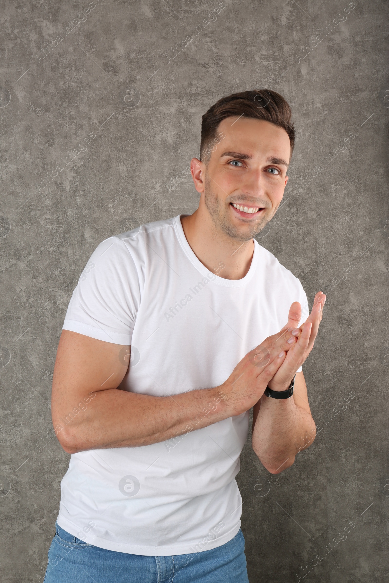 Photo of Portrait of handsome man on color background