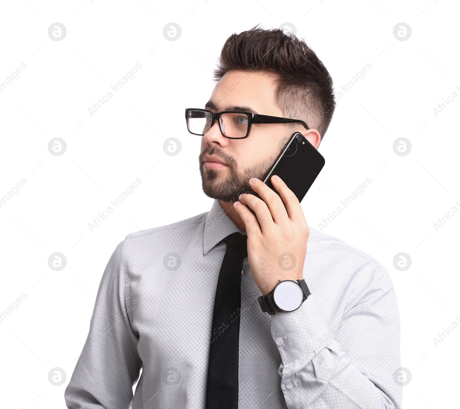 Photo of Young businessman talking on smartphone against white background