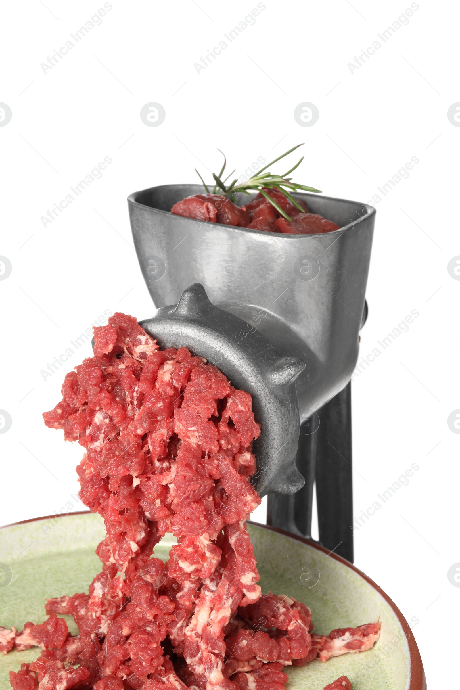 Photo of Metal meat grinder with minced beef and plate isolated on white