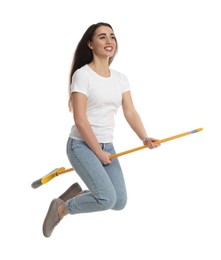 Photo of Beautiful young woman with broom jumping on white background