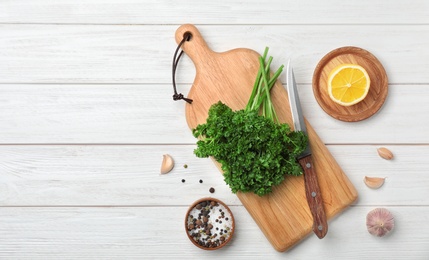 Photo of Flat lay composition with fresh green parsley on wooden background