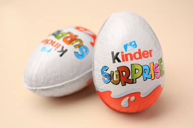 Slynchev Bryag, Bulgaria - May 25, 2023: Kinder Surprise Eggs on beige background, closeup