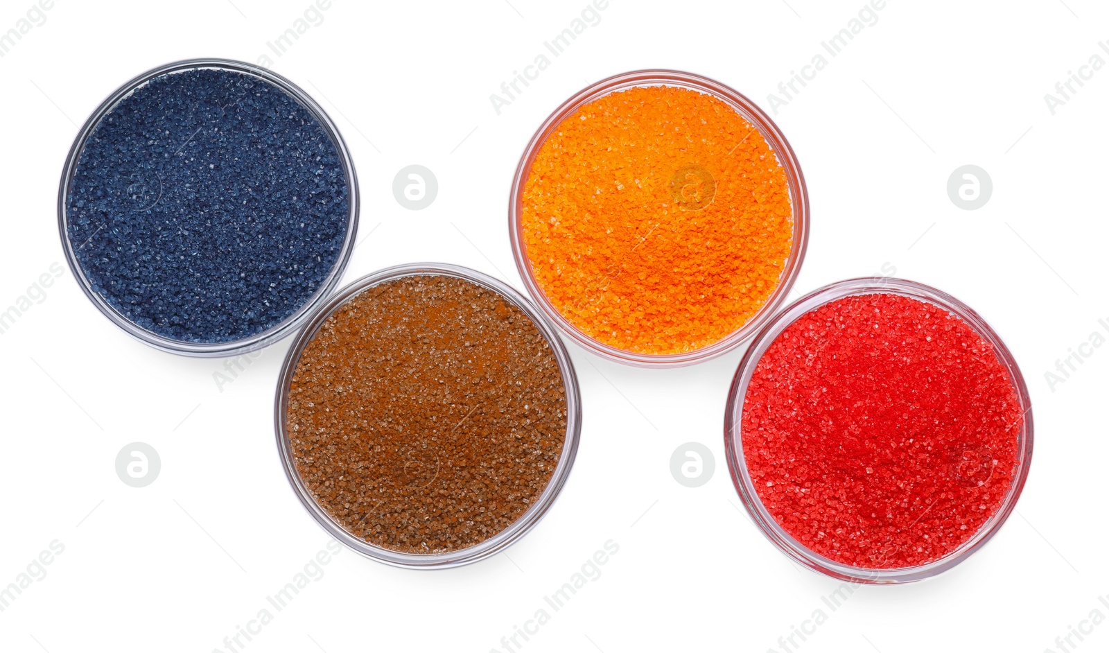 Photo of Glass bowls with different food coloring isolated on white, top view