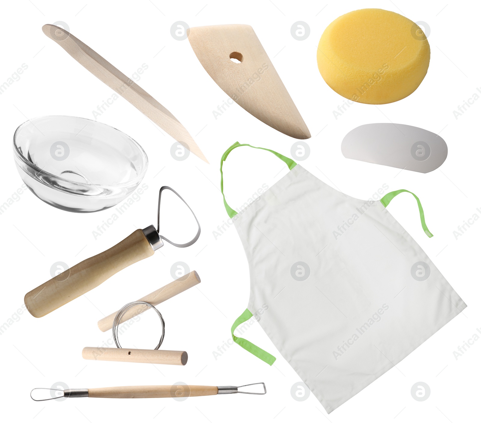 Image of Set of pottery tools, apron and glass bowl on white background