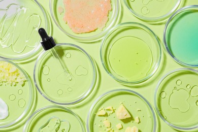 Photo of Flat lay composition with Petri dishes on light green background