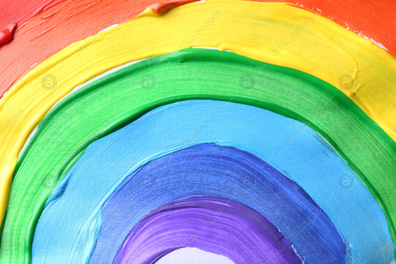 Photo of Rainbow drawn by different paints as background, top view