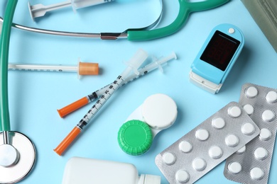 Photo of Flat lay composition with different medical objects on color background