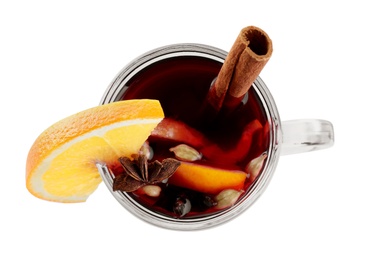 Aromatic mulled wine in glass cup isolated on white, top view