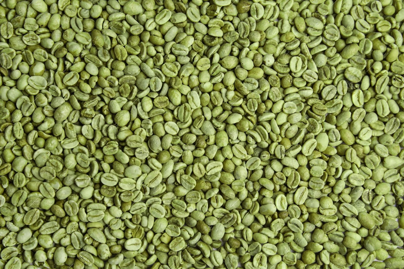 Photo of Pile of green coffee beans as background, closeup